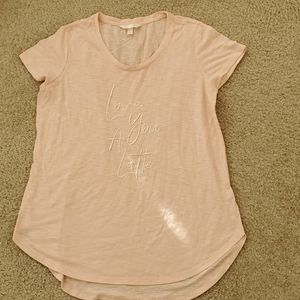 Pink embroidered shirt.